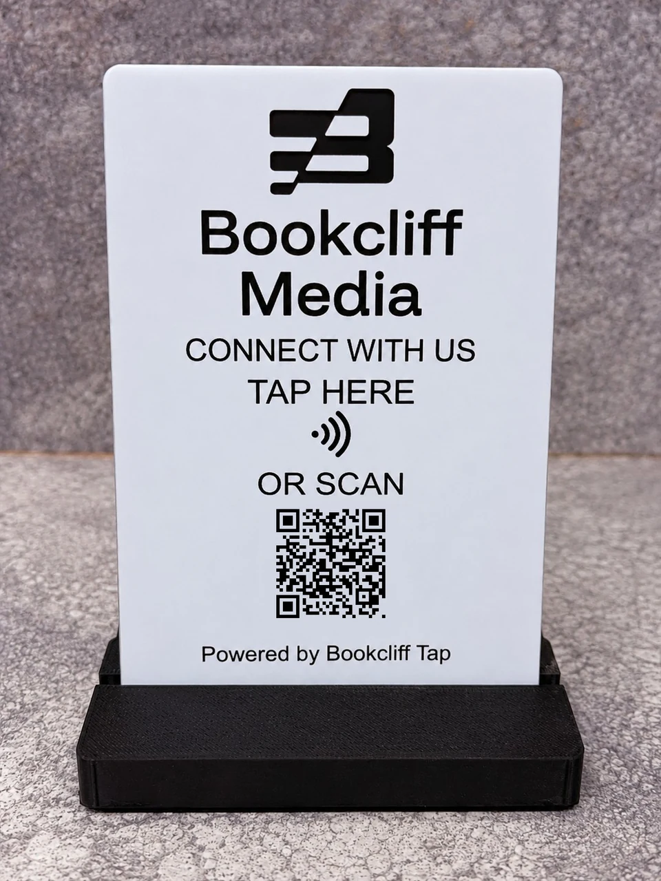 Finished white and black 4 by 6 inch Bookcliff Tap Sign in its display stand